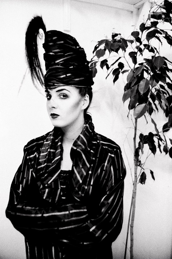 Kim Bowen. Warren Street squat. In Stephen Jones hat. 1980